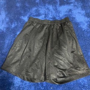 Black athletic shorts with hole in the crotch